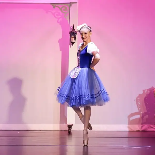 Grace performing in blue tutu